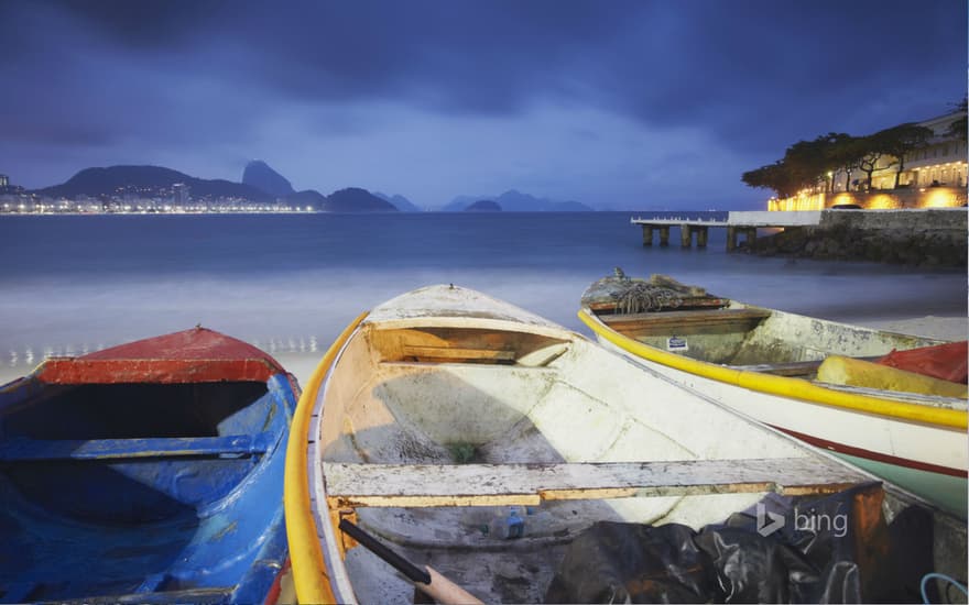 Fishing boats on Copacabana beach at dusk, Rio de Janeiro, Brazil