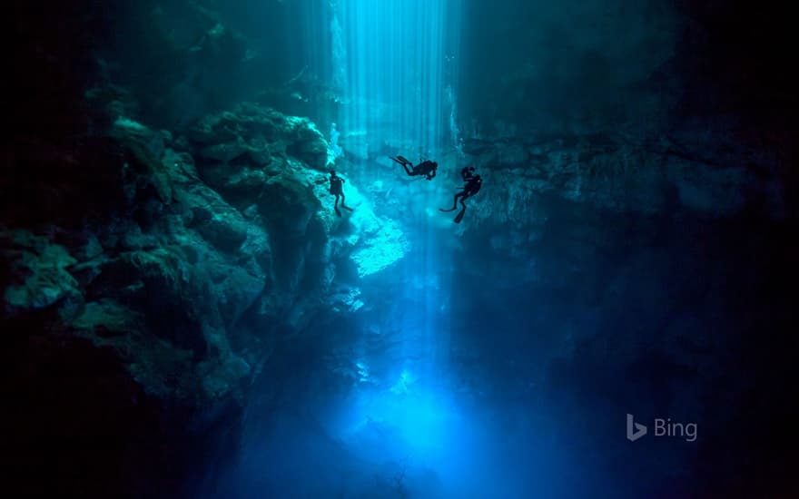 Divers in El Pit, a cenote in Sistema Dos Ojos, Quintana Roo, Mexico