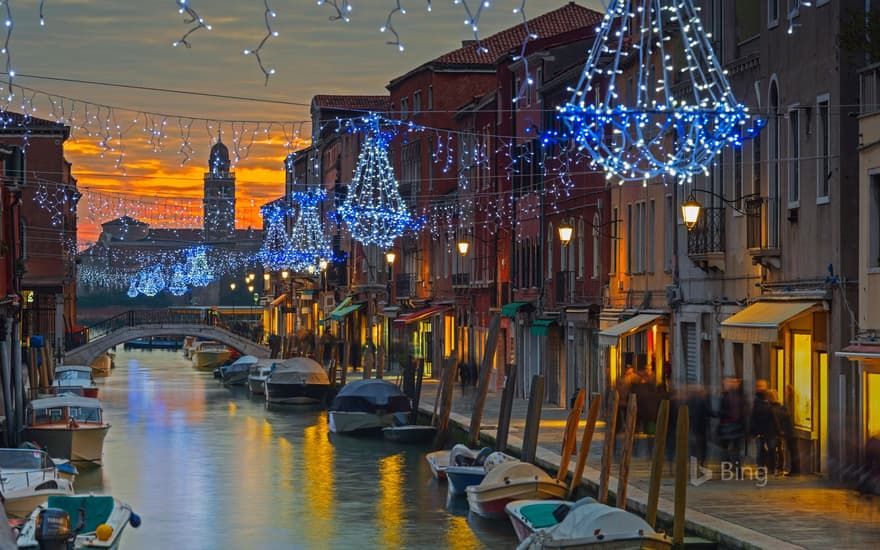 Holiday decorations on a canal in Murano, Italy